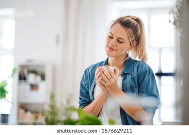 Young Woman Indoors At Home, Enjoying A Cup Of Coffee.