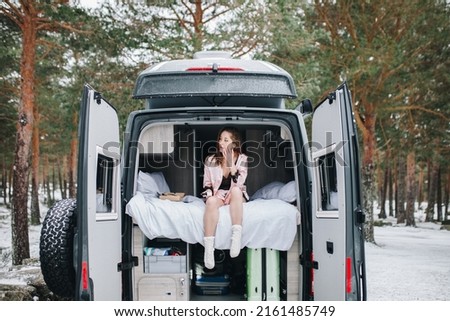 Similar – Image, Stock Photo Woman standing in ladder opening tent over car