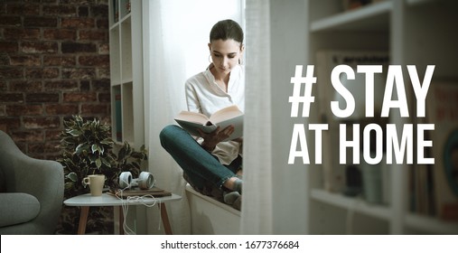 Young Woman Isolating At Home And Relaxing, She Is Reading A Book: Stay At Home Social Media Campaign For Coronavirus Prevention
