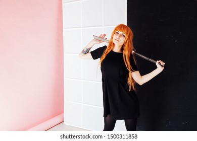 Young Woman In Japanese Anime Cosplay, Holding Samurai Sword.