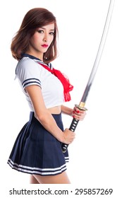 Young Woman In Japanese Anime Cosplay, Holding Samurai Sword.