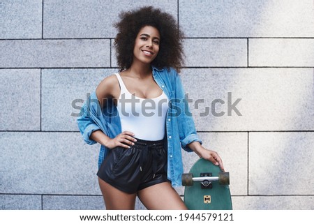 Similar – Image, Stock Photo Happy mixed woman with curly hair standing on the street