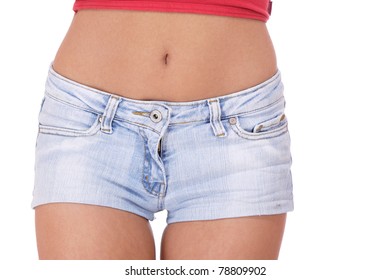 young woman in jeans shorts studio white