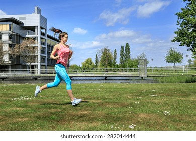 A Young Woman Jogging In The City