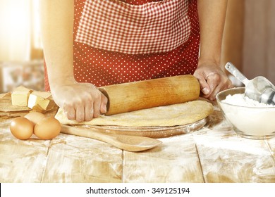 young woman in kitchen eggs and cake  - Powered by Shutterstock