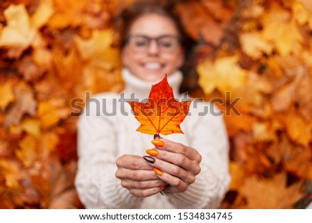 Similar – Image, Stock Photo Woman holding autumn leaves in her hands