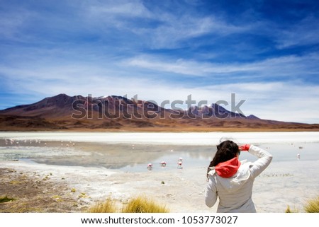 Young woman at Laguna Hedionda at Andean altiplano in Bolivia