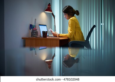 Young Woman With Laptop Computer For Homework. Tired Hispanic Girl And College Education. Female Student Studying And Using Pc At Home