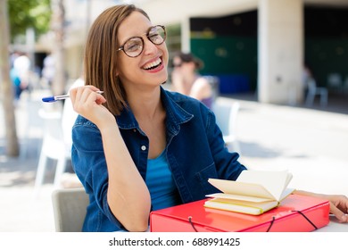 Young Woman Laughting At University