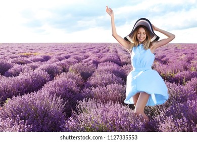 Young Woman In Lavender Field On Summer Day