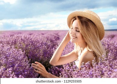 Young Woman In Lavender Field On Summer Day