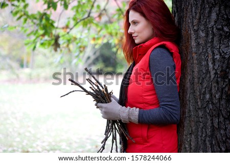 Similar – Image, Stock Photo Woman leans against a wall and puts her feet up.