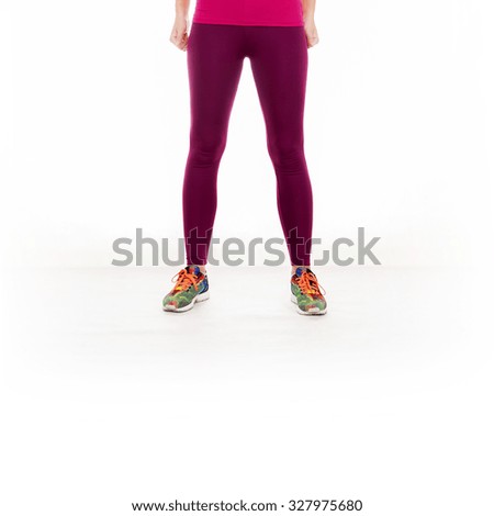 Young woman legs isolated on white background.