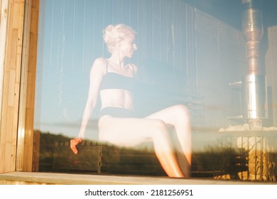 Young Woman Lies On Wooden Shelf In Spa Sauna, Treat Yourself