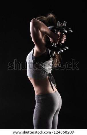 Similar – Rear view portrait of one young middle age athletic woman at crossfit training, exercising with trx suspension fitness straps over dark background