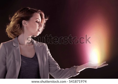 Young woman with light in her hand