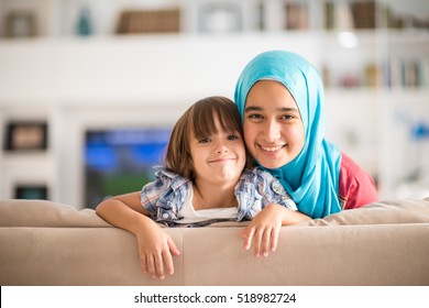 Young woman with little kid at home
