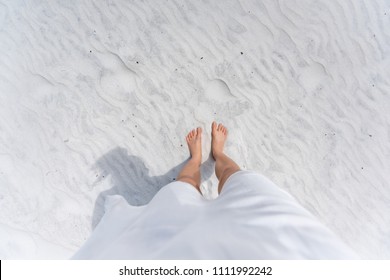 Young Woman Looking Down Pov Point Of View Perspective On Bare Feet Standing In White Sand In Fort Walton Beach, Florida, In White Dress, Flat Top View With Shadow