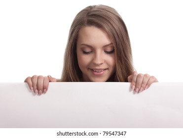 Young Woman Looking Down A White Sign