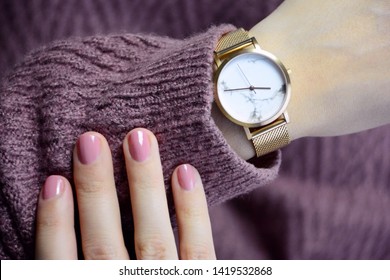 Young Woman Looking At Her Watch