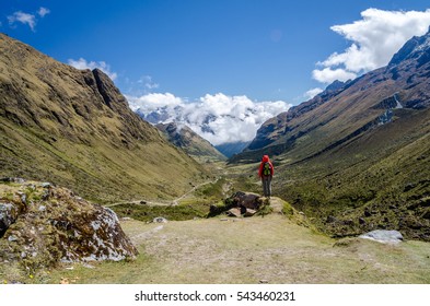 Young woman looking at the scenic view during the Salkantay trek