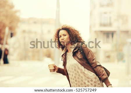 Young woman looking for taxi. 