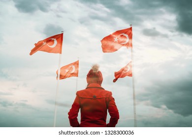 Young Woman Looking Turkish National Flag And Waving It In The Sky.