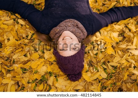 Similar – Image, Stock Photo Young woman lying upside down on an armchair