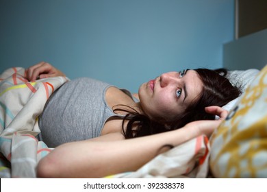 Young Woman Lying In Bed Suffering With Insomnia  Noisy Neighbour, Stress, Alarm Sound, Prevent From Sleep Concept