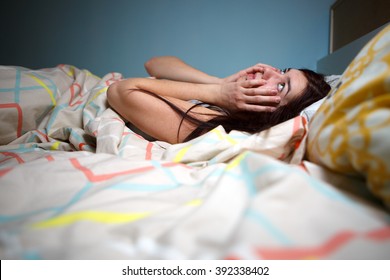 Young Woman Lying In Bed Suffering With Insomnia  Noisy Neighbour, Stress, Alarm Sound, Prevent From Sleep Concept