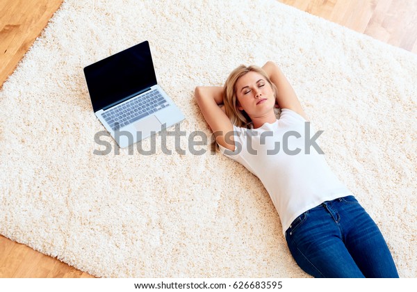 Young Woman Lying Down On Carpet Stock Photo (Edit Now) 626683595