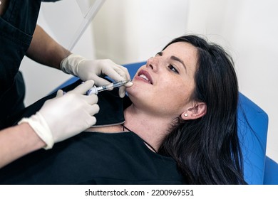 Young Woman Lying Down In Stretcher While Receiving Botulinum Toxin Injection In Beauty Clinic.