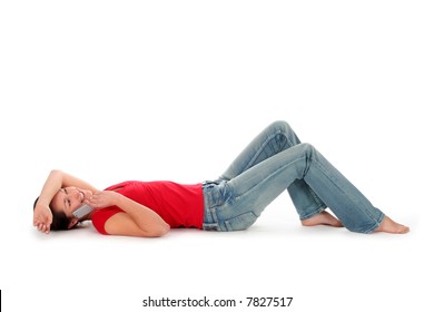 Young Woman Lying Down And Talking On Phone