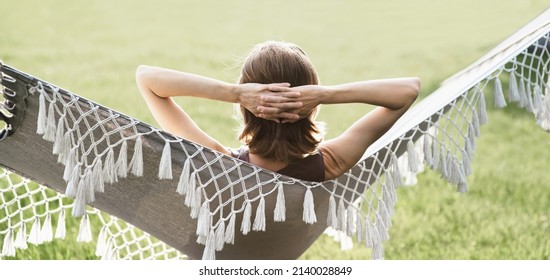 Young woman lying in hammock, enjoying life - Powered by Shutterstock