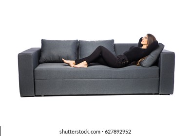 Young Woman Lying On Couch On White Background