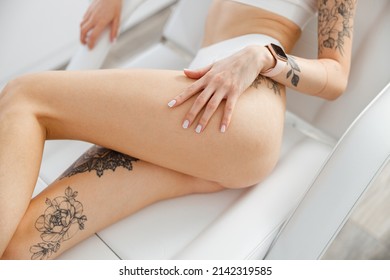 Young woman lying on daybed in beauty salon