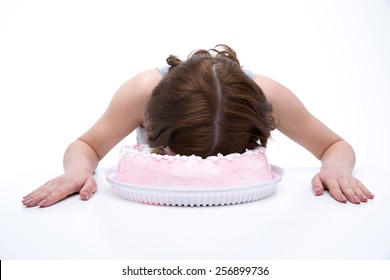 Young Woman Lying On The Table With Face In Cake