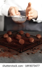 Young Woman Making Chocolate Truffle. Dark Background. Delicious Food Concept. Great Design For Any Purposes.