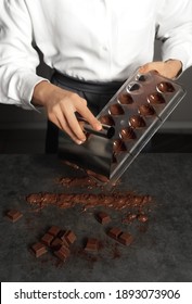 Young Woman Making Chocolate Truffle. Dark Background. Delicious Food Concept. Great Design For Any Purposes.