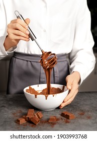 Young Woman Making Chocolate Truffle. Dark Background. Delicious Food Concept. Great Design For Any Purposes.