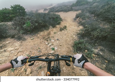 Young woman making downhill with her mountain bike. concept about sport and people