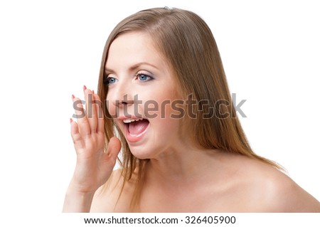 Young woman making faces, isolated on white background
