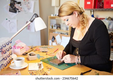 Young Woman Making Jewelry At Home