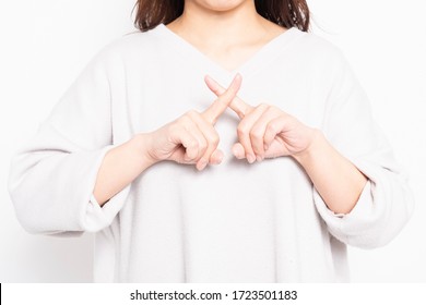 
Young Woman Making An NG Sign