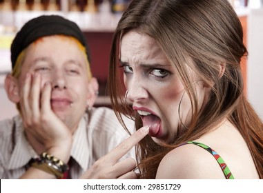 Young Woman Making Rude Gesture On A Bad Date