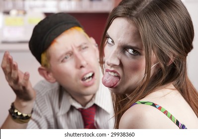 Young Woman Making Rude Gesture On A Bad Date