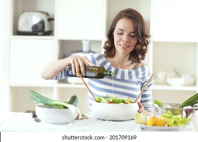 Young Woman Making Salad