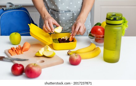 Young Woman Making School Lunch In The Morning. Close Up On Pair Of Young Female Hands Preparing Breakfast And A Snack For School For Her Children. Concept Healthy Food For Schoolchild