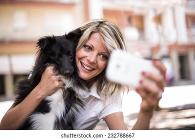 Young Woman Making A Selfie With Her Dog