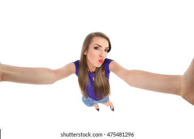 Young Woman Making A Selfie And Sending A Kiss. Fish Eye Studio Shot Isolated On White.